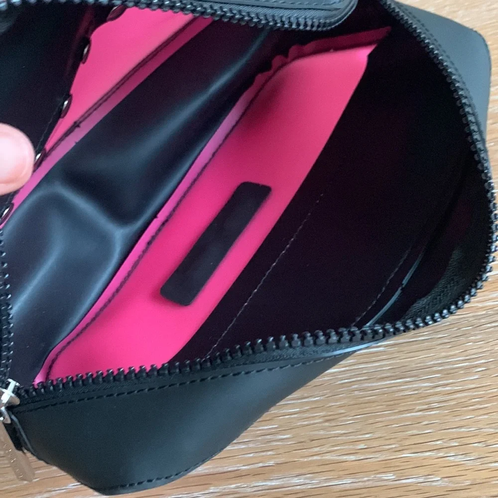 BCBGeneration plastic zippered cosmetic case pink black
